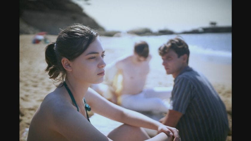 L’Événement - A still from the movie. The protagonist on the beach.